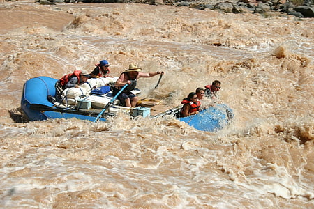group of people riding on blue raft thumbnail