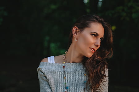 Woman in Grey Off Shoulder Sweater Staring in the Left Side of View thumbnail