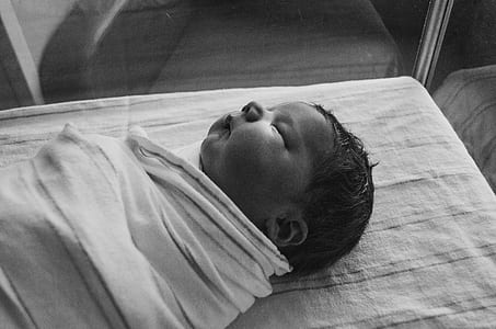grayscale photo of baby thumbnail