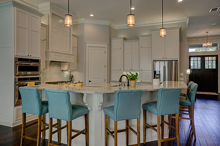 white sectional bar counter with bar chairs in kitchen thumbnail