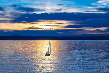 landscape photography of sailboat on body of water thumbnail