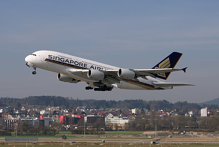 white Singapore Airlines airplane taking off at daytime thumbnail