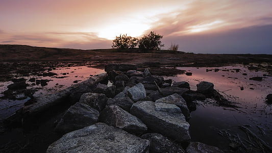 gray rocks on body of water thumbnail