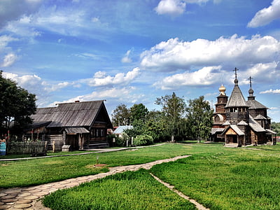 brown and gray church on grass field thumbnail