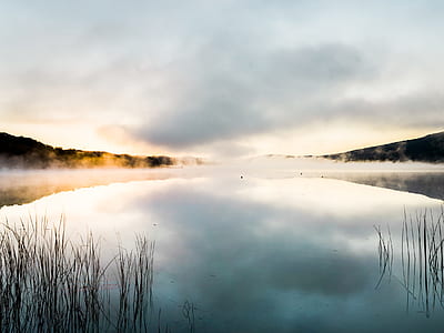 landscape photo of body of water during daytime thumbnail