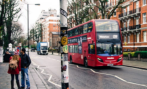 man and woman beside road at daytime thumbnail