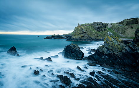 photo of mountains near ocean thumbnail