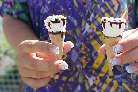 person carrying two ice cream cones thumbnail