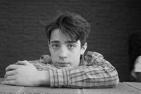 grayscale photo of man on gray surface thumbnail