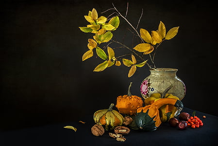 white ceramic vase beside pumpkins thumbnail