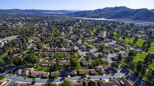 aerial view photography of houses surrounded by trees during daytime thumbnail