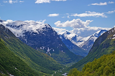 mountain view covered with snow during daytime thumbnail