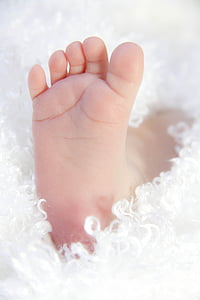 baby's foot in shallow focus photography thumbnail