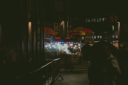silhouette photography of street food by night thumbnail