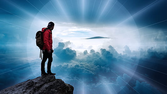man wearing red hooded jacket; black backpack; black pants thumbnail