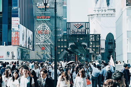 crowd of people in the middle of city thumbnail