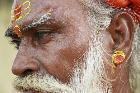 close-up photography of man's face with paint thumbnail