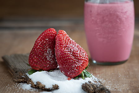 two strawberry fruits on table thumbnail