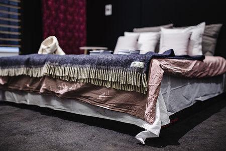 Beds with pillows on a designer exhibition thumbnail