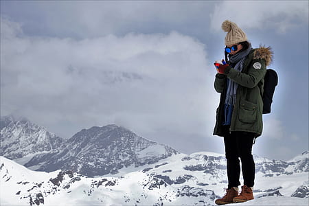 woman standing on mountain at winter season thumbnail