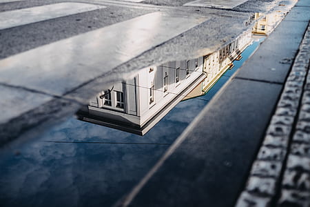 photo of building reflecting on water thumbnail