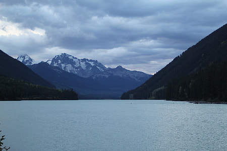 landscape photography of body of water and mountains thumbnail