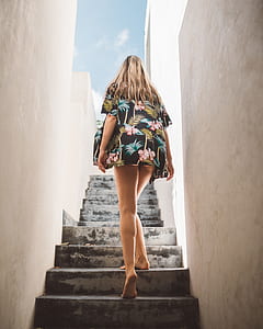 woman walking in the gray concrete stair thumbnail