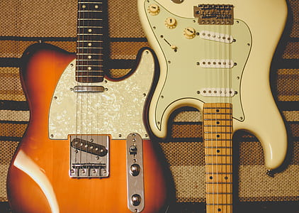 brown and white electric guitars thumbnail