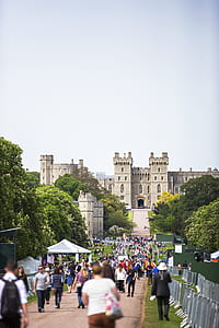 people walking towards beige castle thumbnail