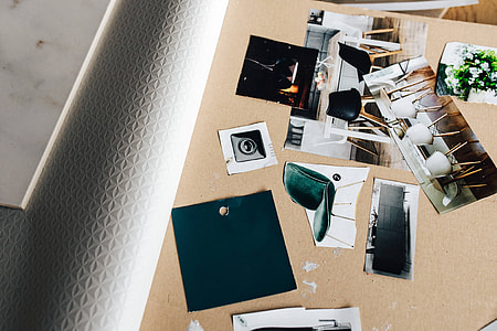 Designers working with material samples and paper cutouts thumbnail