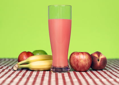 red apple near banana and clear glass cup thumbnail