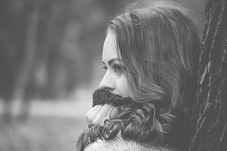 woman standing beside tree thumbnail