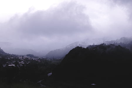 high angle photo of mountain covered with fogs thumbnail