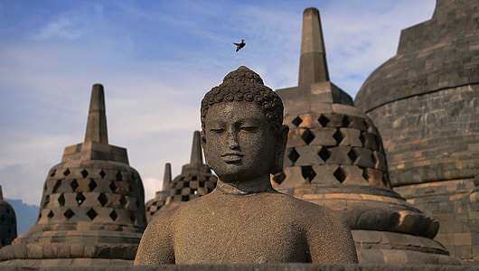 brown concrete Buddha statue during daytime thumbnail