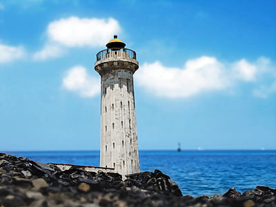 white lighthouse near sea thumbnail
