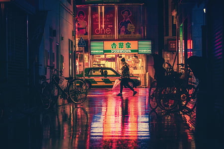 woman walking on pathway during nighttime thumbnail