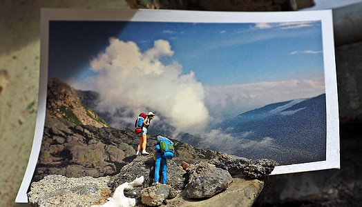 two people climbing on mountain photo thumbnail