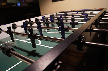 foosball table near wall inside room thumbnail