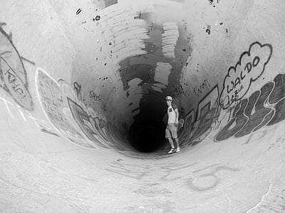 man standing inside tunnel thumbnail