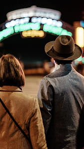 man wearing brown cowboy hat thumbnail
