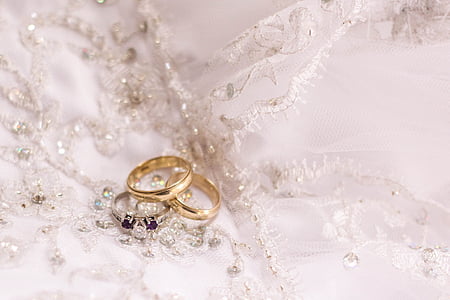 two gold-colored and one silver-colored rings thumbnail