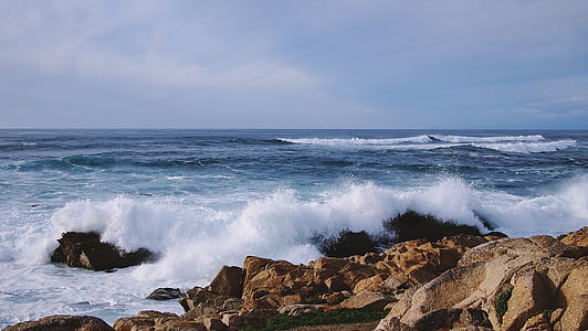 ocean near brown rock during daytime thumbnail