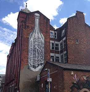 Giant mural on the side of an office conversion in New Cross, Manchester. thumbnail