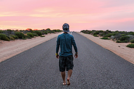man walking on road thumbnail