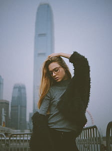 woman wearing gray turtleneck shirt and black cardigan thumbnail
