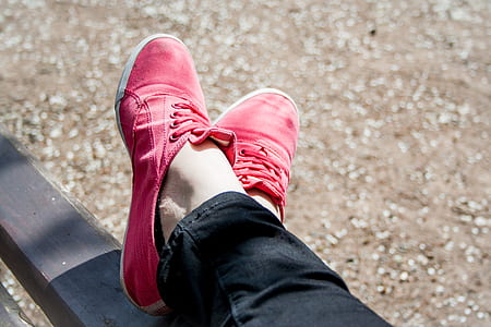 person wearing pair of red shoes thumbnail