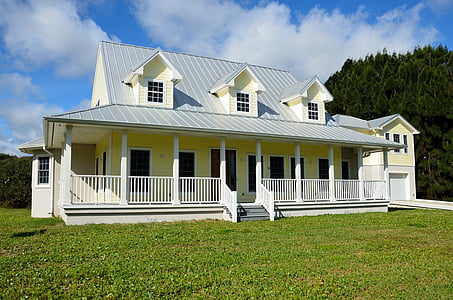 house near trees with lawn field thumbnail