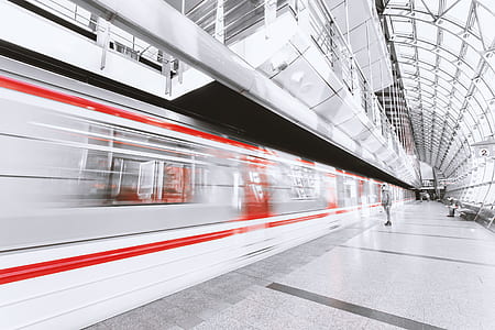 Blurred Motion of Illuminated Railroad Station in City thumbnail