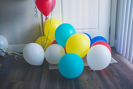 bunch of balloons on brown wooden floor thumbnail