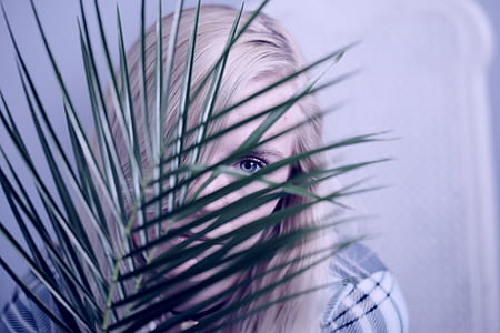 woman hiding on plant thumbnail